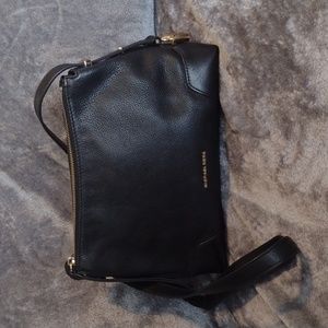 NWOT Michael Kors pebbled leather handbag, with gold colored locks on sides.